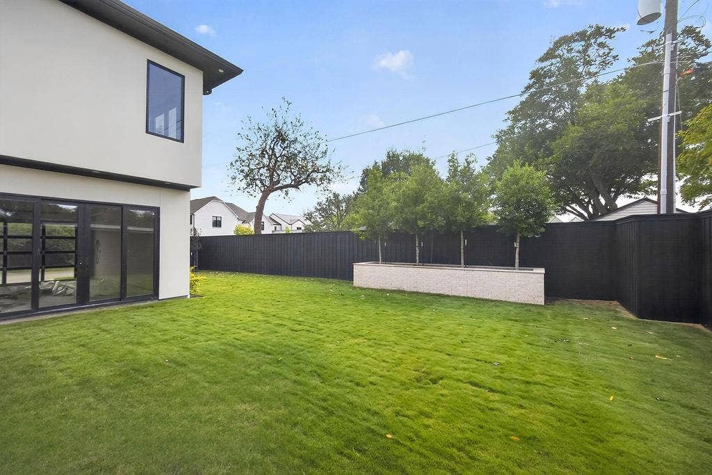 Let pets run freely or play lawn games on the green, low-maintenance yard enclosed by privacy fencing