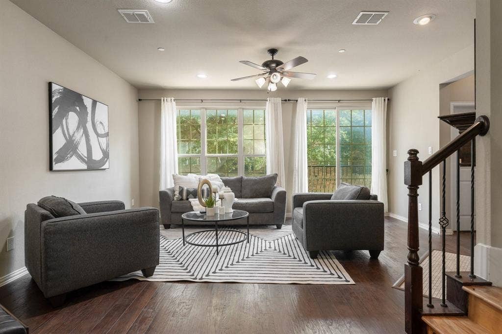 Living area featuring dark wood-finish flooring, recessed lighting, ceiling fan, and sliding glass doors