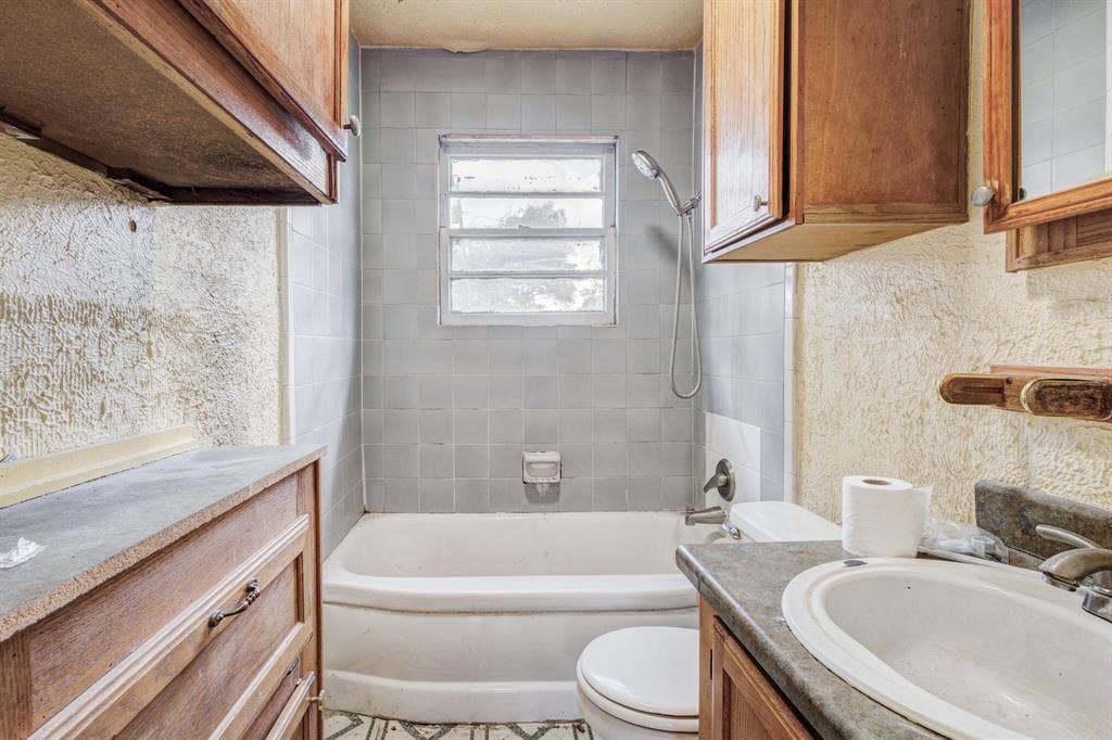124 Rio Rita Drive, Garland, TX 75040 bathroom with cabinet space