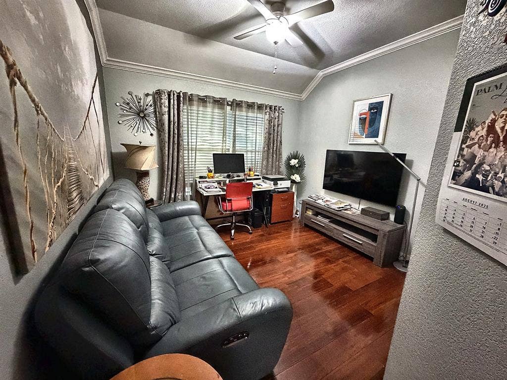 416 Wooded Creek Avenue, Wylie, TX 75098 Room featuring wood-finish flooring, vaulted ceilings, and a central ceiling fan with integrated lighting
