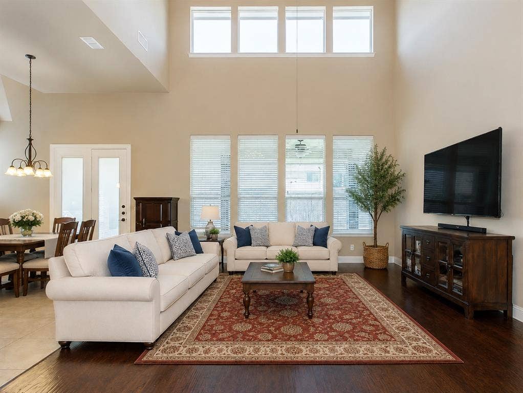 13812 Nash Lane, Frisco, TX 75035 Expansive living area featuring soaring ceilings and wood-finish flooring