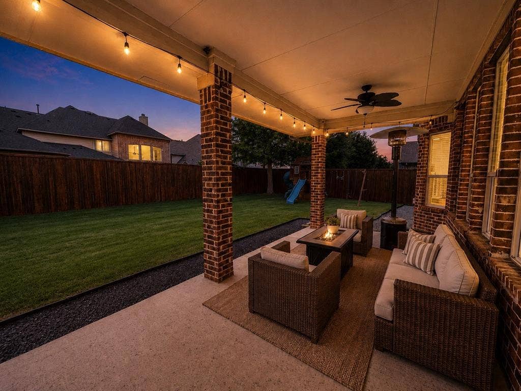 13812 Nash Lane, Frisco, TX 75035 Covered patio featuring brick pillars, string lighting, and a ceiling fan