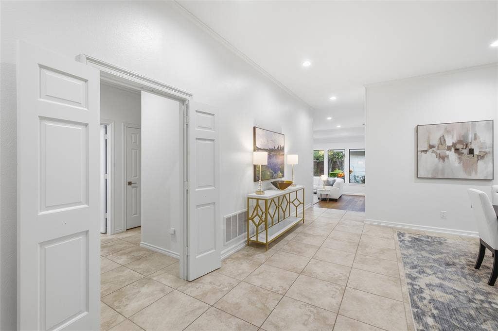 4115 Brooktree Lane, Dallas, TX 75287 Double doors close off the secondary bedroom wing for quiet and privacy, with the living room just beyond.