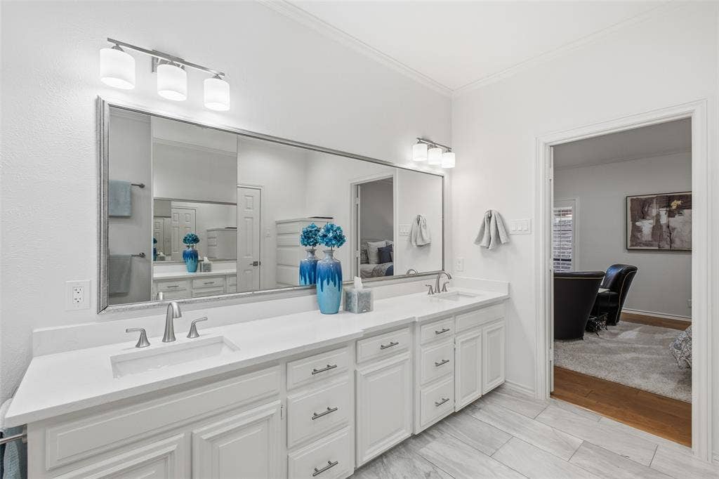 4115 Brooktree Lane, Dallas, TX 75287 Dual vanity with quartz countertops and abundant drawer storage, steps from the primary bedroom.