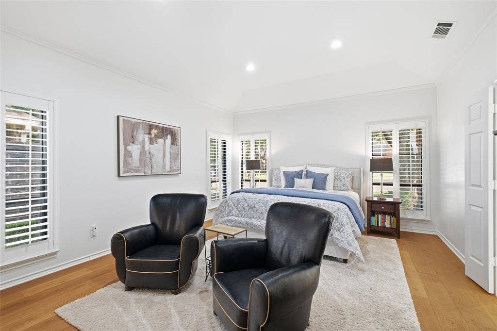 4115 Brooktree Lane, Dallas, TX 75287 Your primary retreat: plantation shutters, wide-plank wood floors, and room for a cozy sitting area.