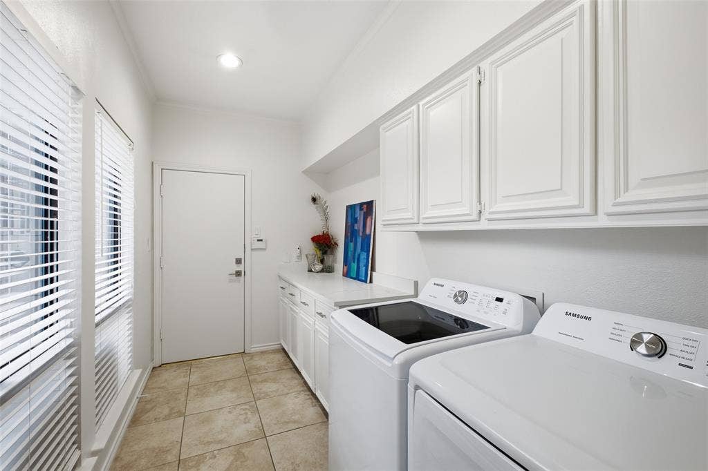 4115 Brooktree Lane, Dallas, TX 75287 Utility room with built-in cabinets and counter space, with direct access to the garage.