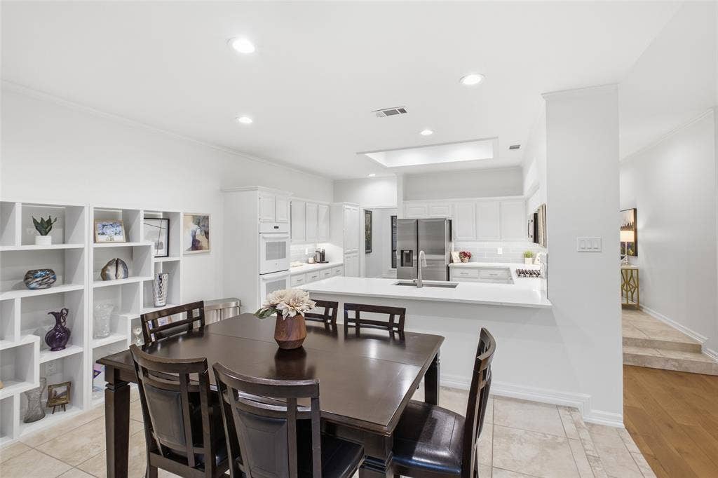4115 Brooktree Lane, Dallas, TX 75287 Built-in shelving, a sunny nook, and the kitchen steps away make weeknight dinners feel easy.