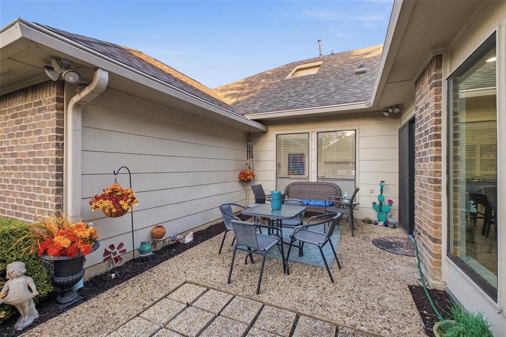 4115 Brooktree Lane, Dallas, TX 75287 A private side courtyard ready for bistro dinners and outdoor living under the Texas sky.