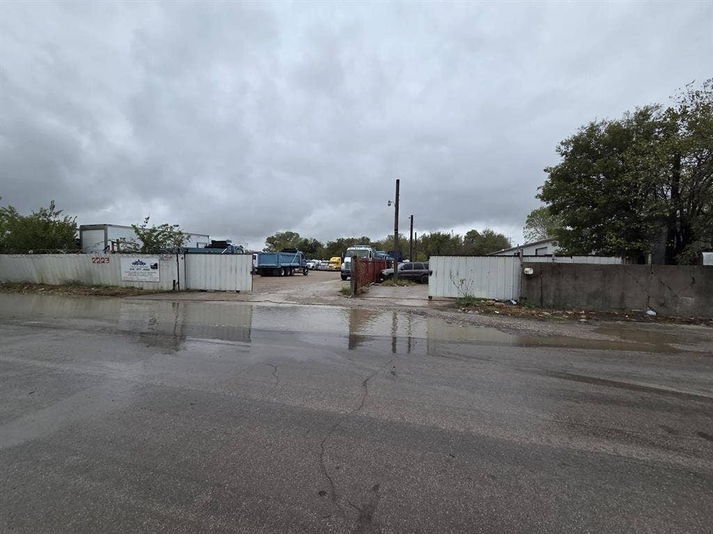 2311 Cartwright Street, Dallas, TX 75212 Industrial exterior lot featuring perimeter fencing, gated access, and an asphalt surface