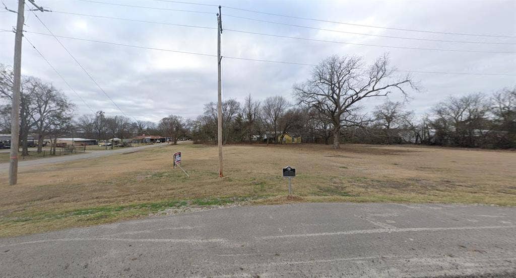 Expansive level lot featuring cleared terrain and mature trees