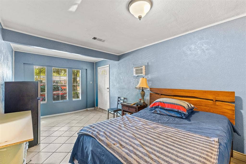 1801 Pleasant Run Road, Carrollton, TX 75006 Ceramic tile flooring, multi-pane windows, and a flush-mount ceiling light fixture