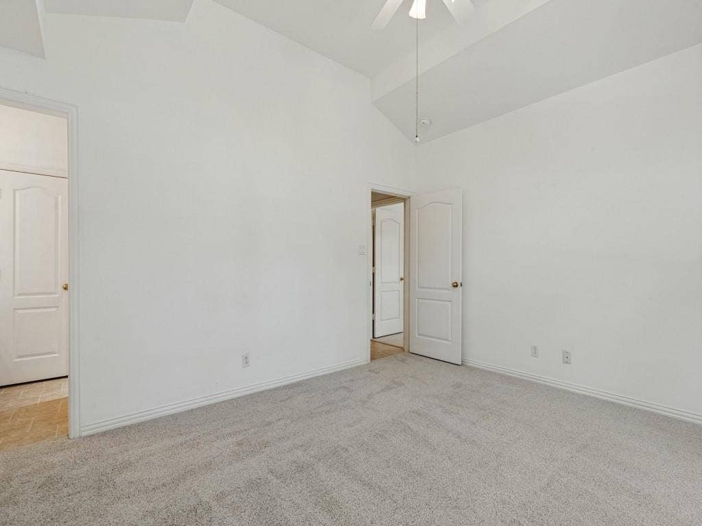 2817 Mayfair Lane, McKinney, TX 75071 Vaulted ceiling, wall-to-wall carpeting, and interior arched-panel doors