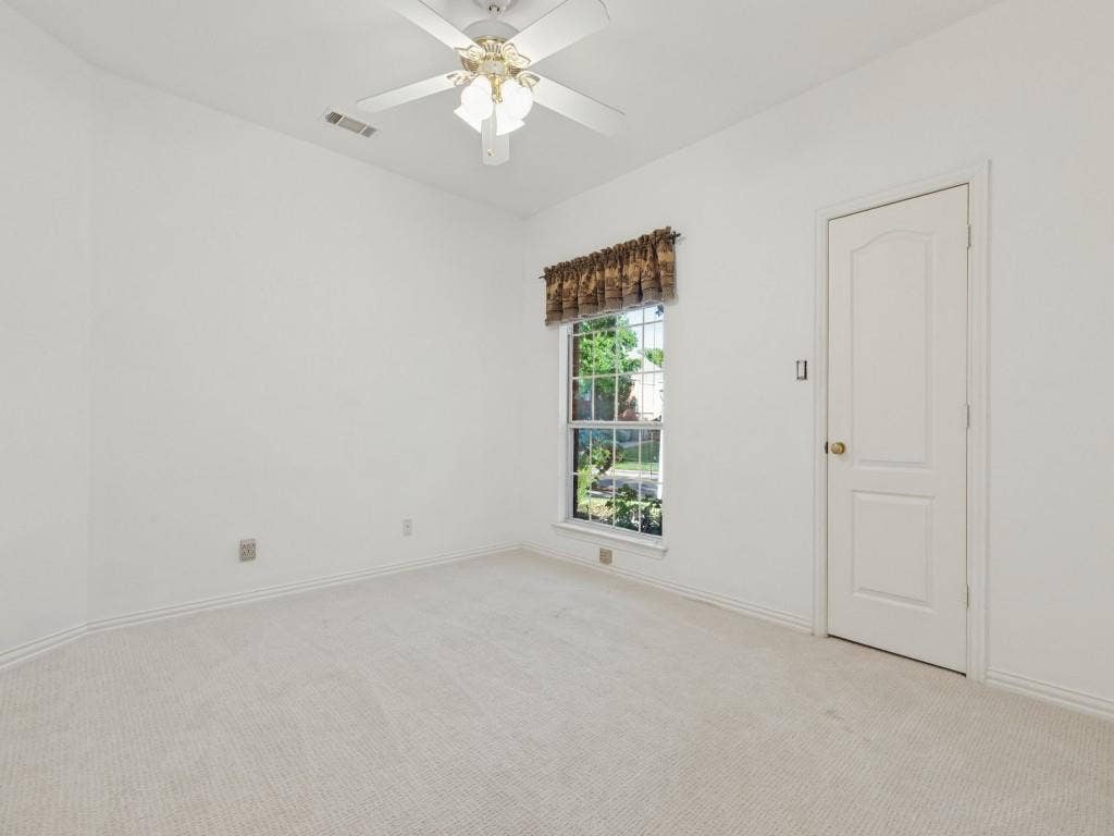 2817 Mayfair Lane, McKinney, TX 75071 Neutral-toned wall-to-wall carpeting, single-hung window with natural light, and ceiling-mounted fan with integrated light fixture