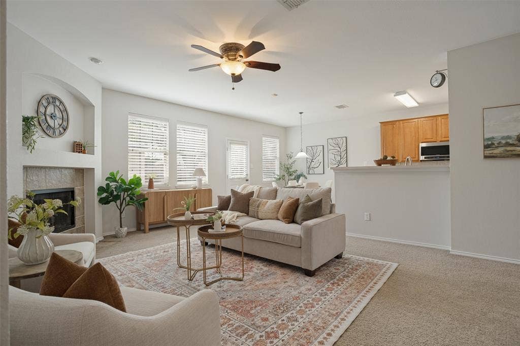 Inviting living room with fireplace and open to the kitchen