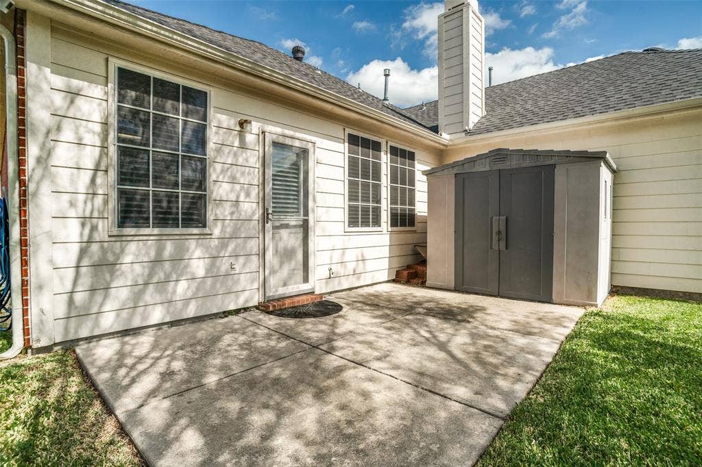 Concrete patio and convenient outdoor storage shed