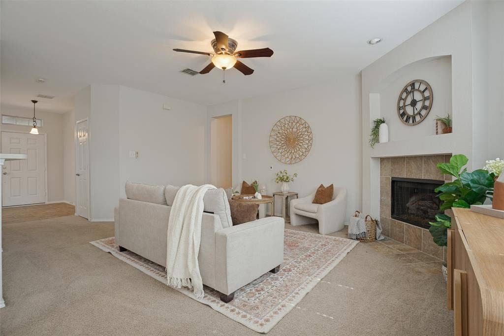 Living room perspective showing the fireplace and decorative wall niche