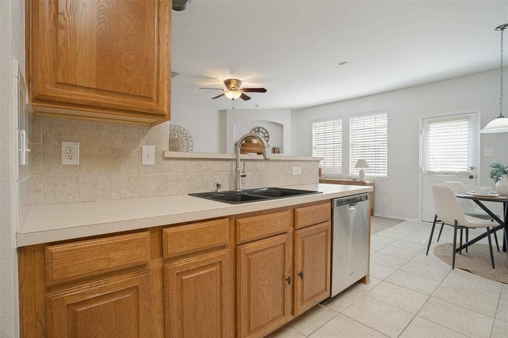 Kitchen sink, dishwasher, generous countertops and convenient breakfast area