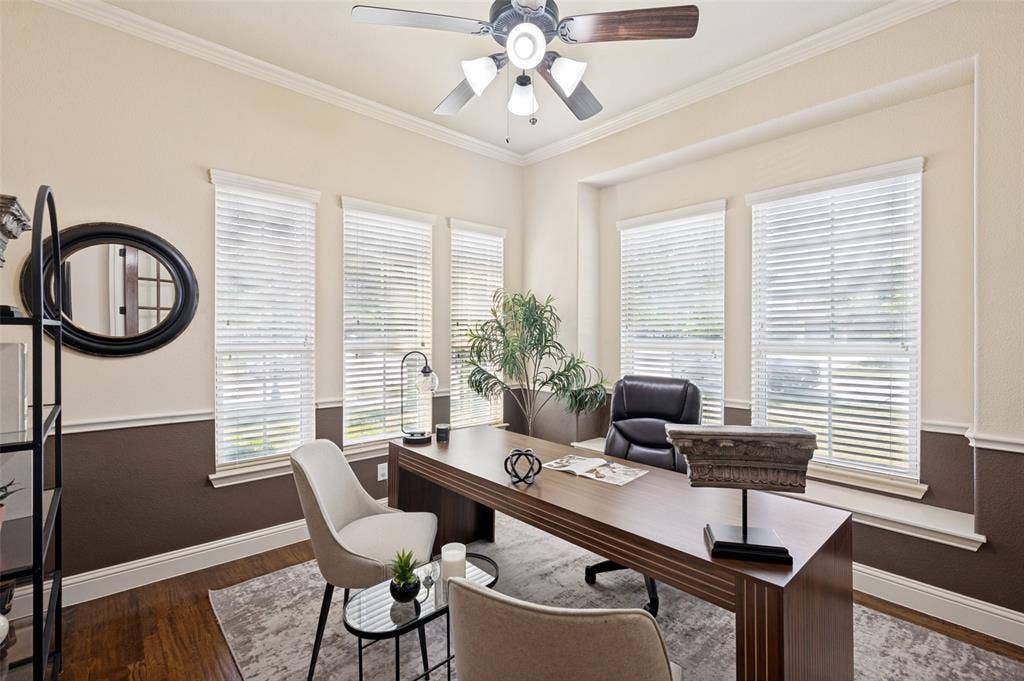 6448 Fire Creek Trail, Frisco, TX 75036 Room featuring wood-finish flooring, two-tone wall paint, chair rail molding, crown molding, and a ceiling fan with integrated lighting