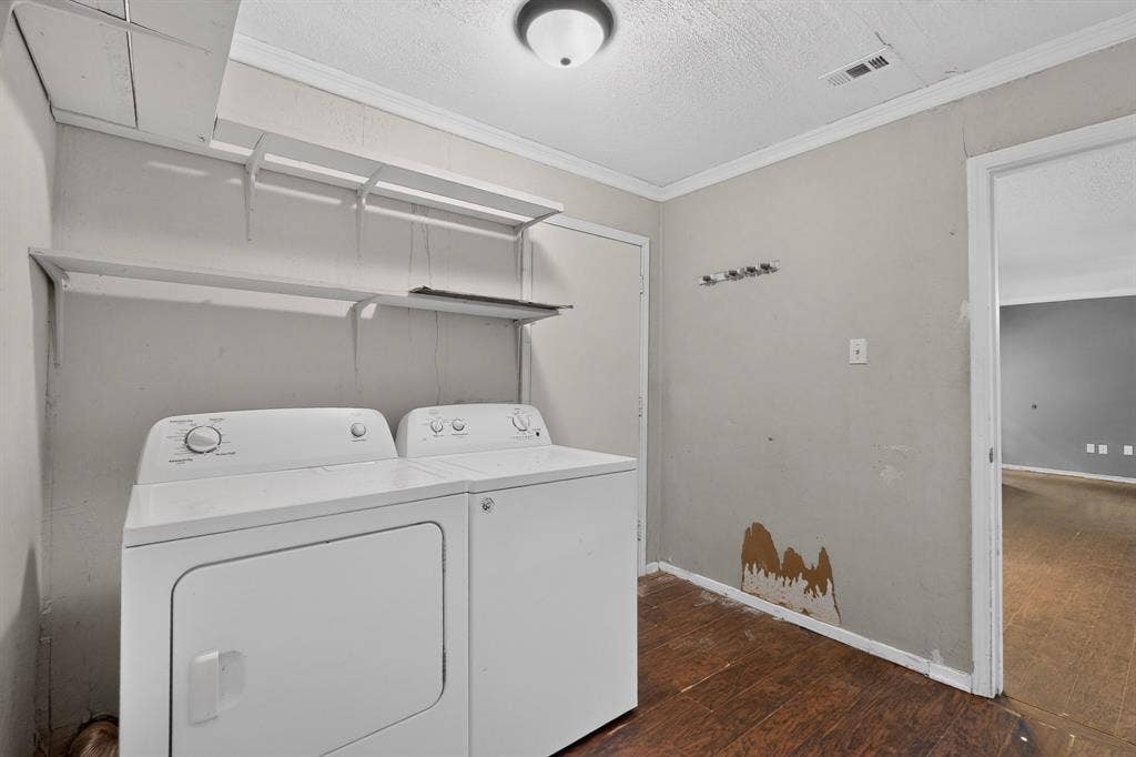 9651 Cherry Street, Frisco, TX 75033 Utility room featuring wood-finish flooring, ceiling-mounted lighting, and built-in wall shelving