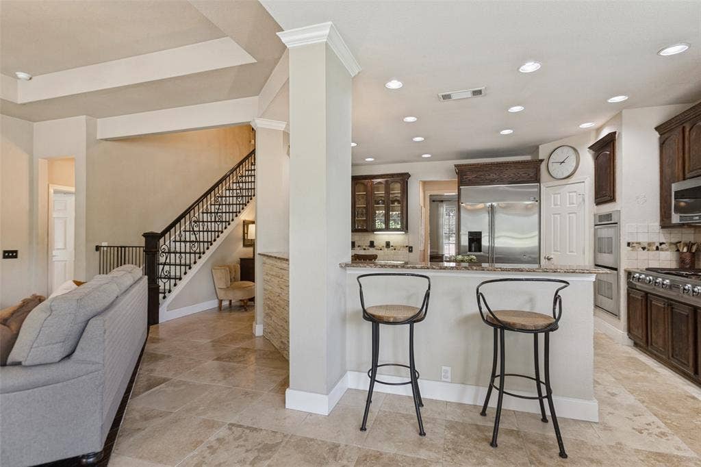 214 Stanford Ct. - Open-concept layout seamlessly connecting the living room, breakfast area, and kitchen.