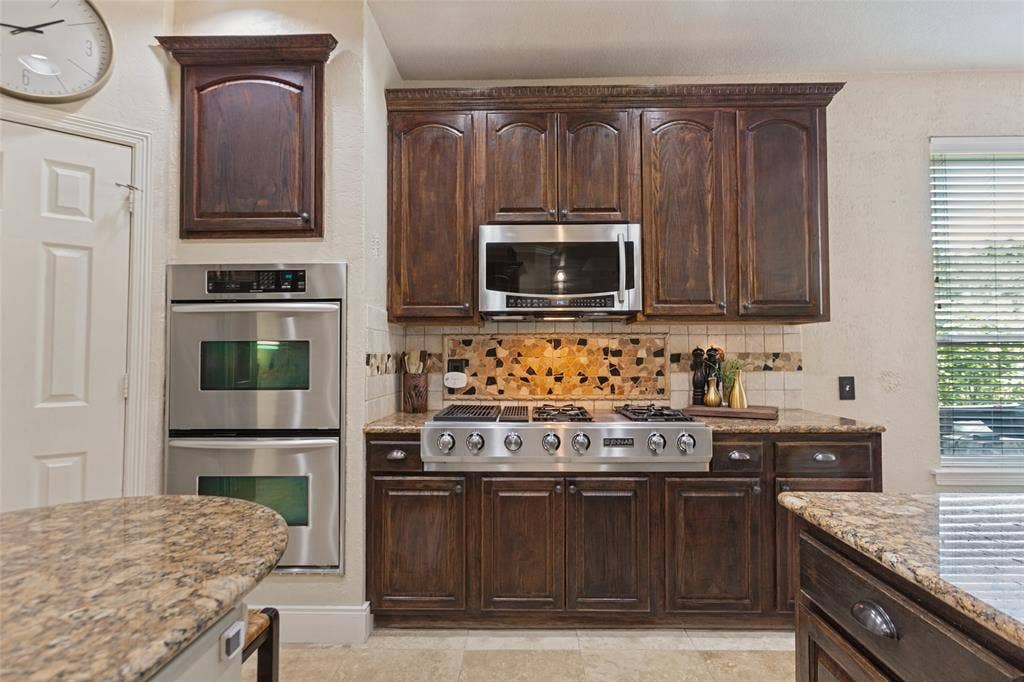 214 Stanford Ct. - Bright breakfast area with convenient counter seating and views of the patio and pool.