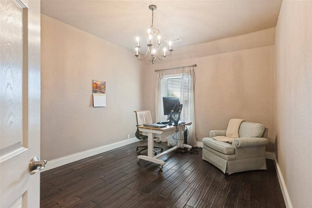 214 Stanford Ct. - Second-floor bedroom featuring hardwood flooring and decorative lighting.