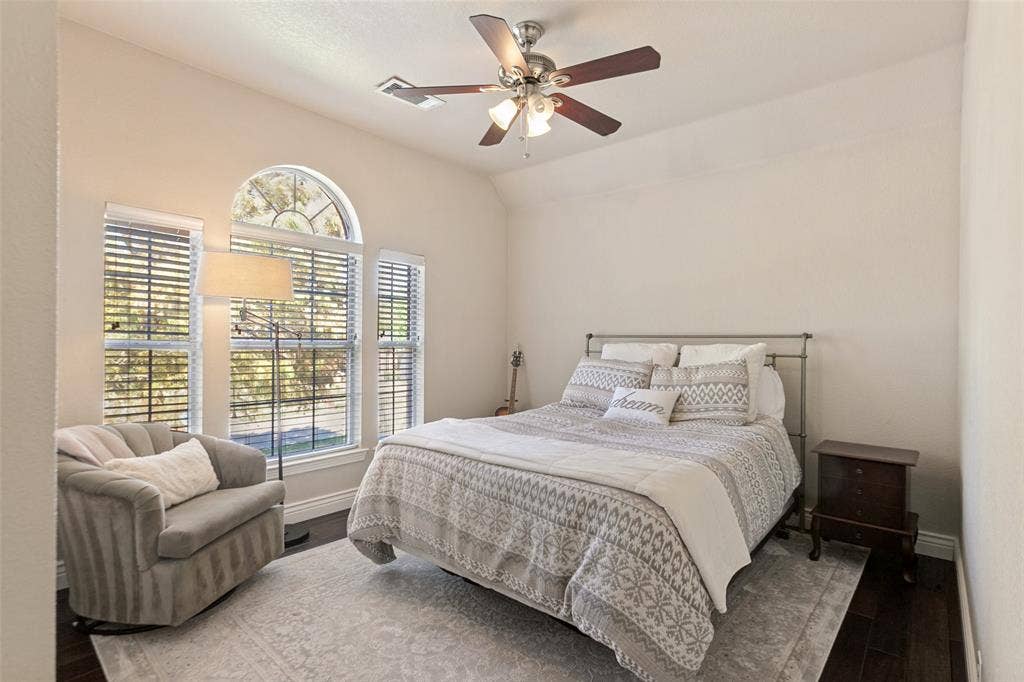 214 Stanford Ct. - Second-floor bedroom featuring hardwood flooring and ceiling fan.