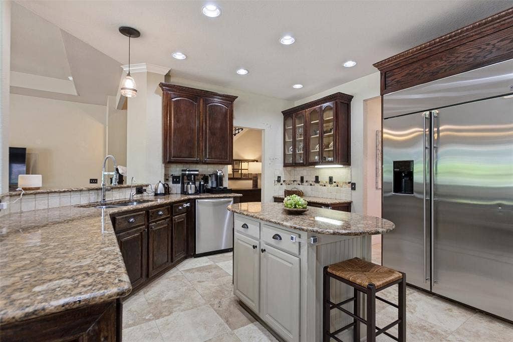 214 Stanford Ct. - Kitchen featuring a convenient built-in desk area for everyday organization and household tasks.