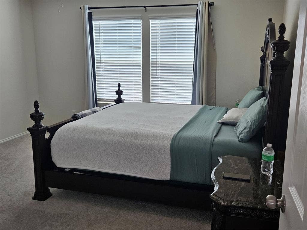 1860 Ballinger Drive, Forney, TX 75126 Neutral-toned carpeting, dual windows, and horizontal slat blinds