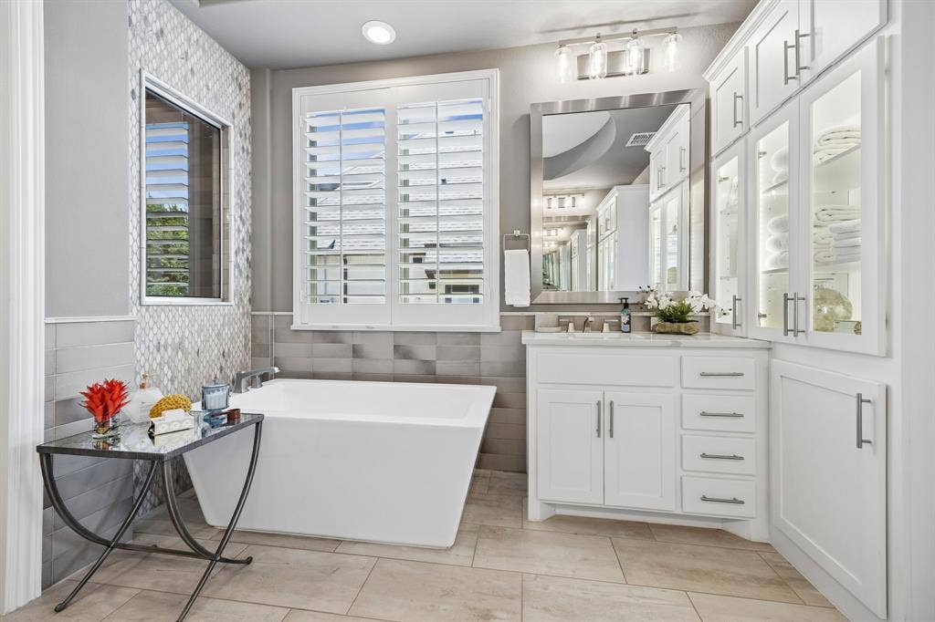 641 Country Brook Lane, Prosper, TX 75078 Notice the stunning use of different tiles on the wall, floor, and shower exterior all designed by IBB Design Group.