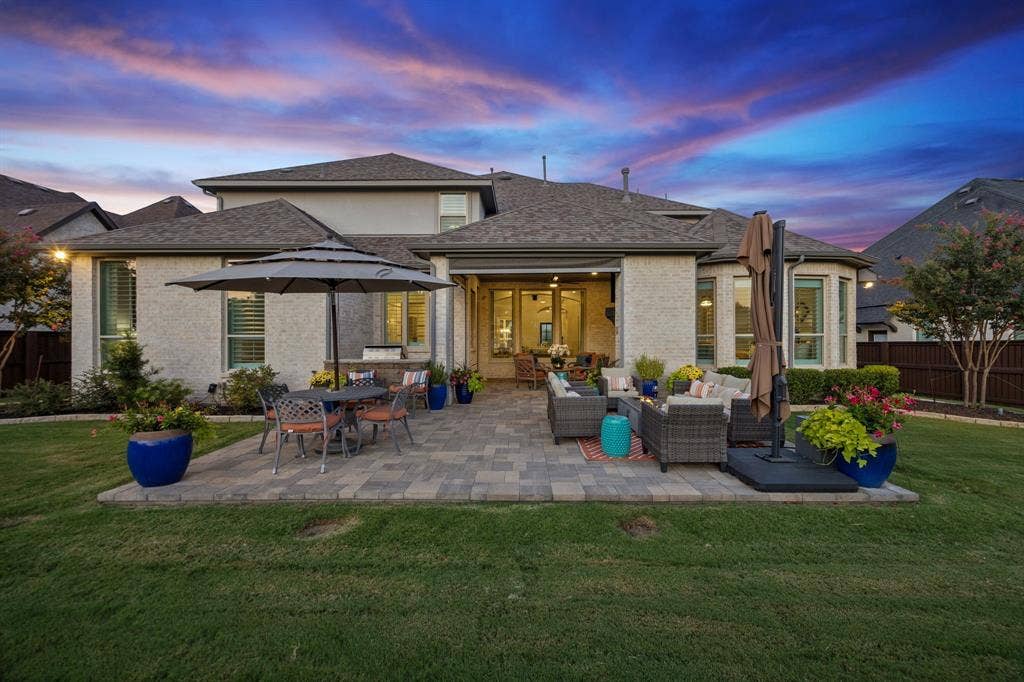 641 Country Brook Lane, Prosper, TX 75078 Oversized patio with built-in grill and fireplace is perfect for entertaining.