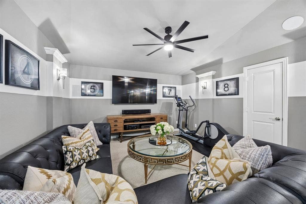 641 Country Brook Lane, Prosper, TX 75078 You'll love watching your favorite movies or sports teams in this comfortable media room.