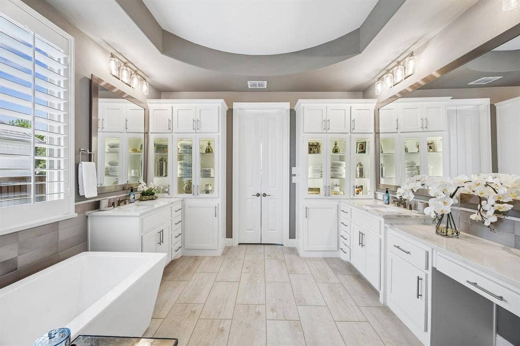 641 Country Brook Lane, Prosper, TX 75078 The gorgeous master suite offers tons of backlit cabinetry, high end quartz counters, soaking free standing tub and lots of natural light!