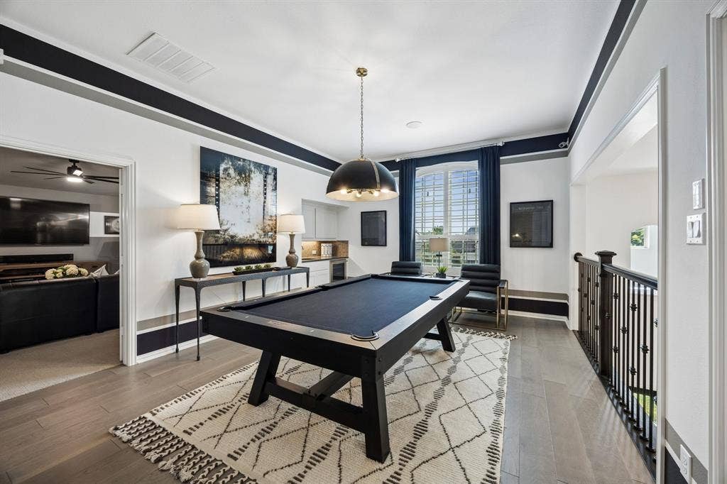 641 Country Brook Lane, Prosper, TX 75078 Game room has a wet bar and beverage fridge.