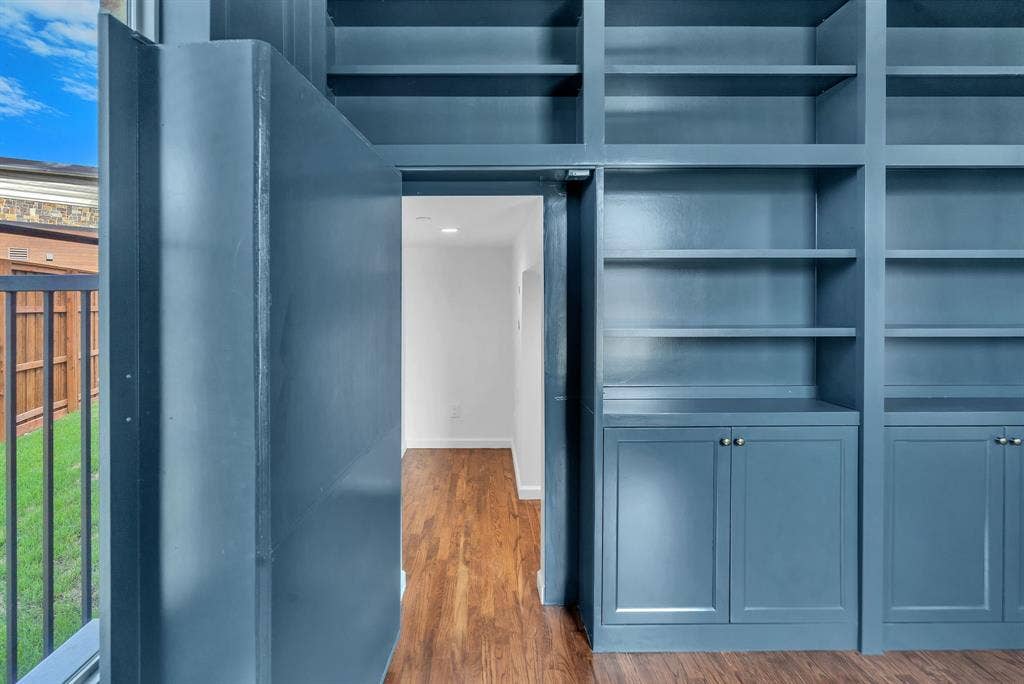 Hidden door in bookcase leads to under stair storage room