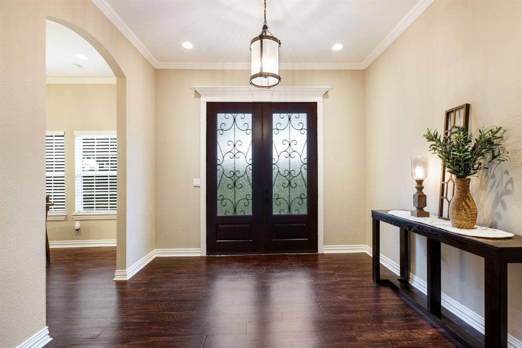 Beautiful grand entry with double iron doors!