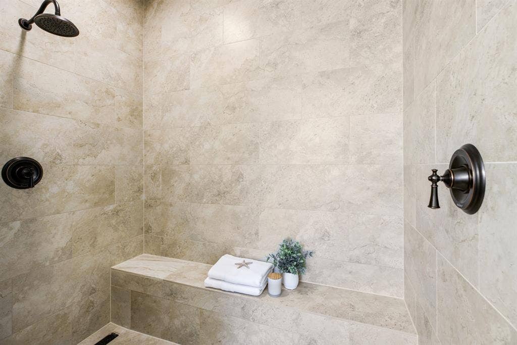 Escape the day under the soothing flow of a premium rainshower, double shower heads and a built-in seat for the ultimate wind-down experience.