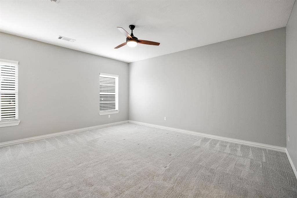 Enjoy the elegant palette choice of the primary suite with a designated sitting area.