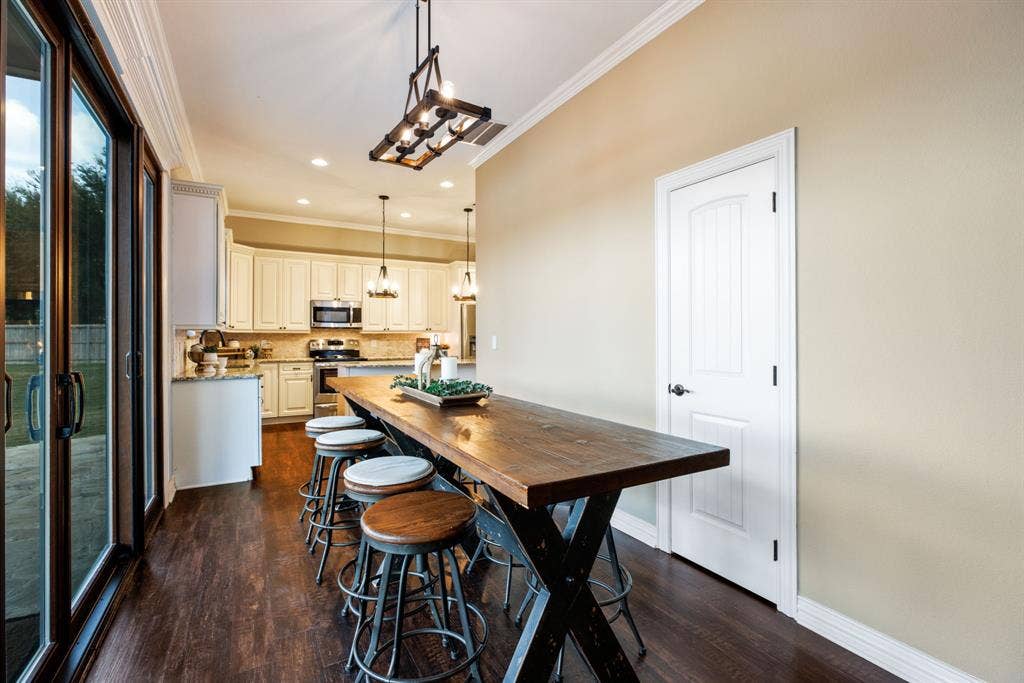 Guests can mingle effortlessly between the formal dining room, casual breakfast nook, and the spacious kitchen island.