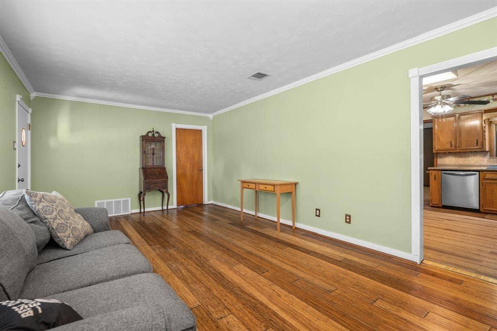 920 Avenue C, Lacy Lakeview, TX 76705 Wood-finish flooring, crown molding, and solid wood interior doors