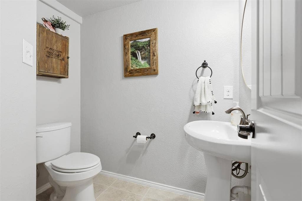 Half bath is perfectly situated off of the living room.