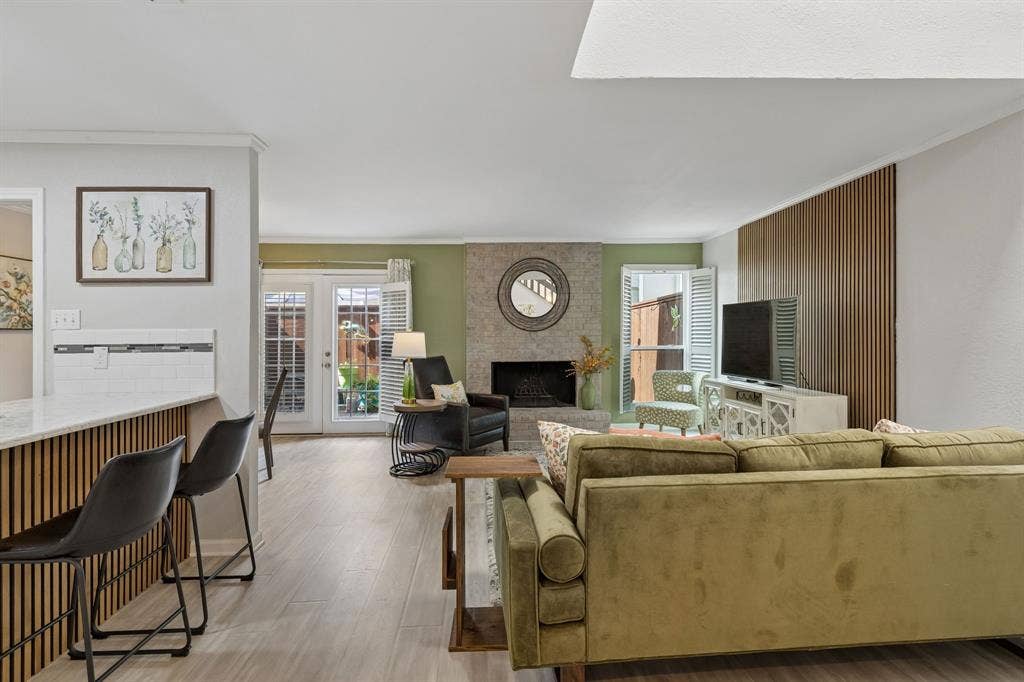 2103 Country Villa Drive, Carrollton, TX 75006 Living room opens to updated kitchen & dining