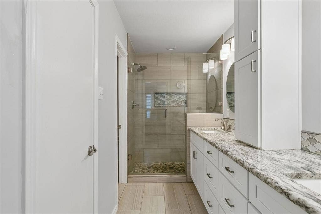 2103 Country Villa Drive, Carrollton, TX 75006 Remodeled ensuite, primary bath with shower, dual vanities, water closet and walk-in closet