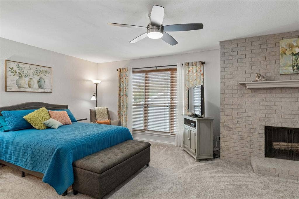 2103 Country Villa Drive, Carrollton, TX 75006 Huge primary bedroom with fireplace