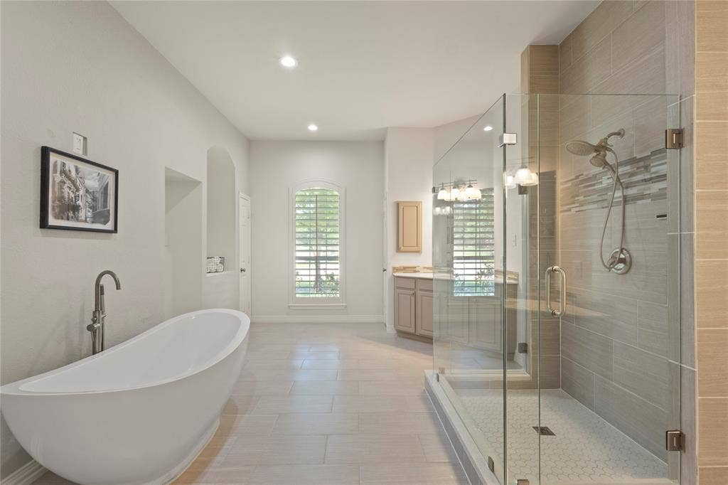 Soaking tub, separate sinks, New frameless shower,