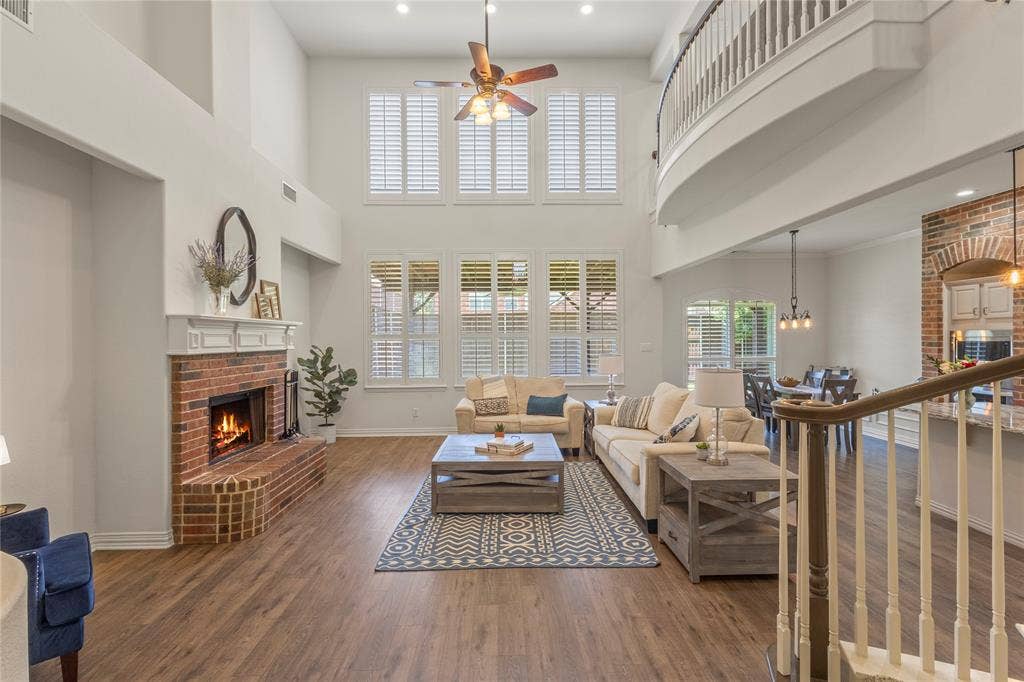 Soaring ceilings, open floorplan. Plantation shutters. Wood burning fireplace