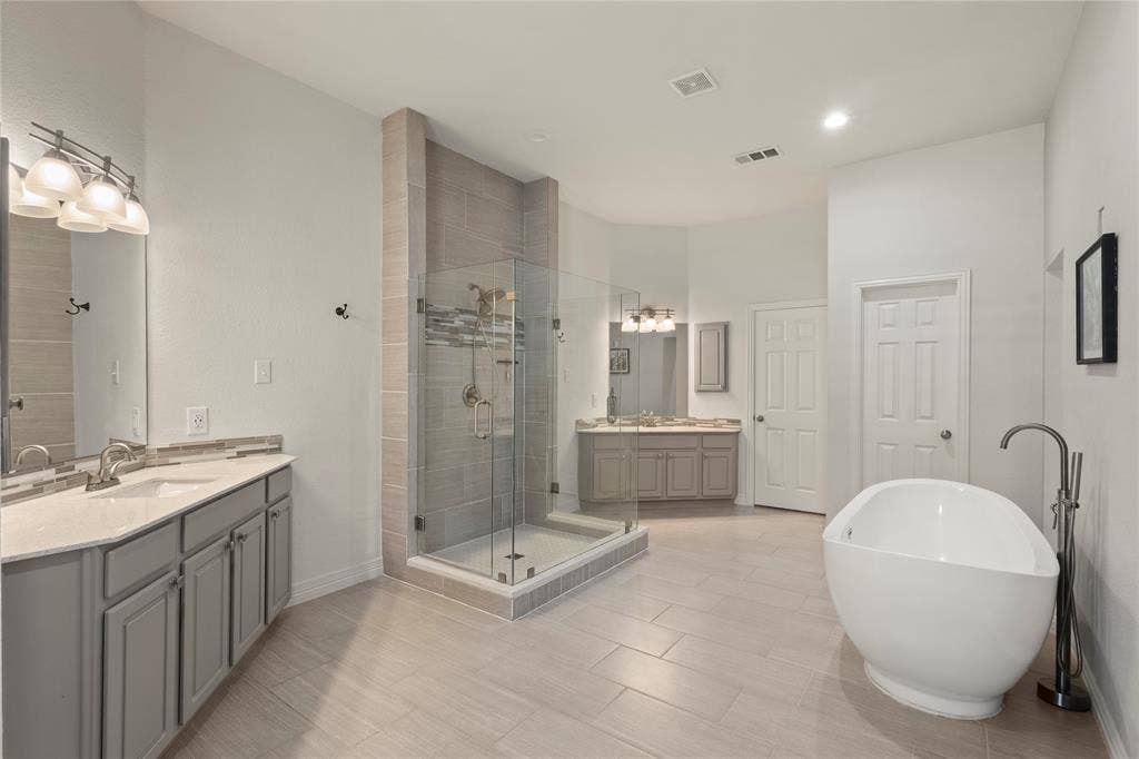 Separate sinks, new frameless shower, soaking tub