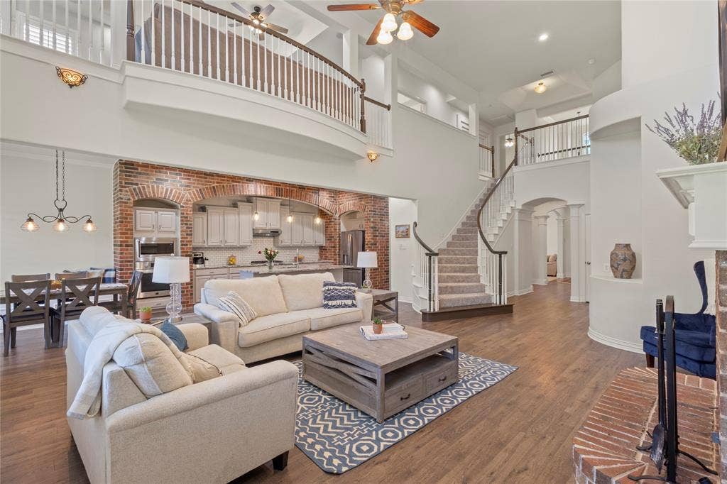 Soaring ceilings, open concept, woodburning fireplace