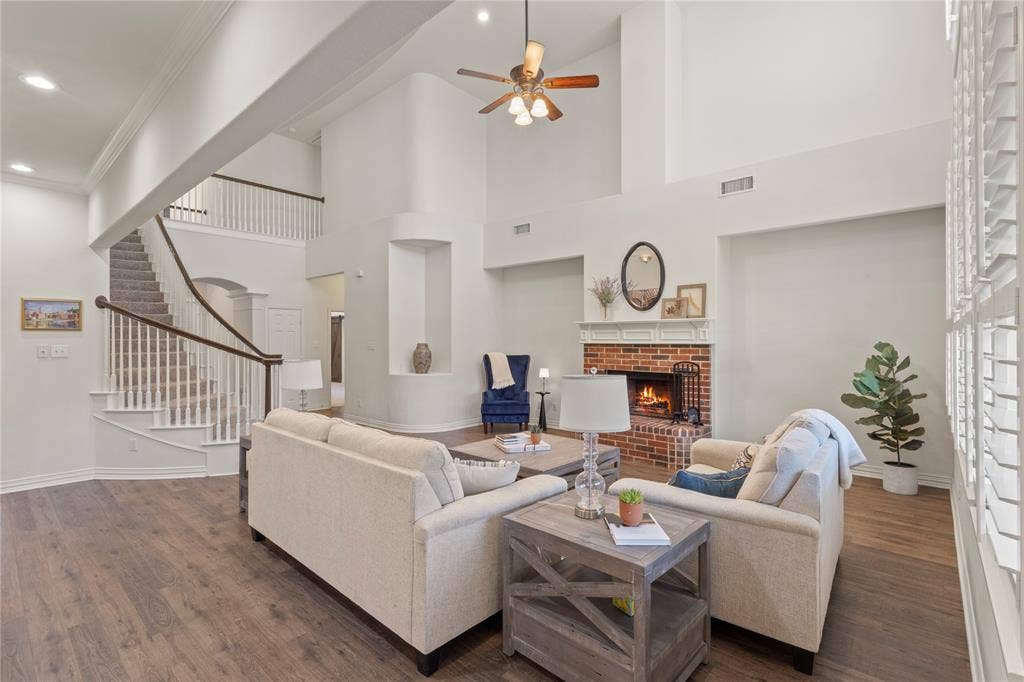 Open concept, soaring ceilings, wood burning fireplace