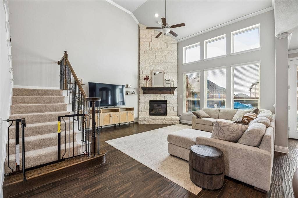 2816 Driftwood Creek Trail, Celina, TX 75078 Family room open to the kitchen with floor to ceiling stone fireplace.